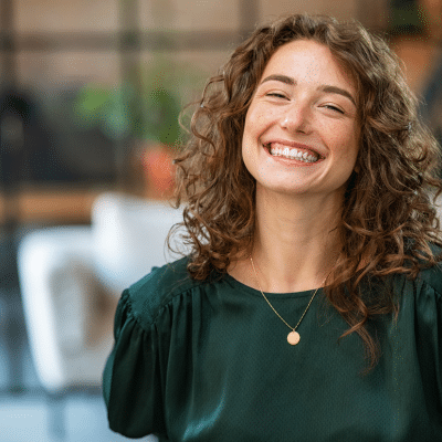 Teenage girl smiling, showing dental health