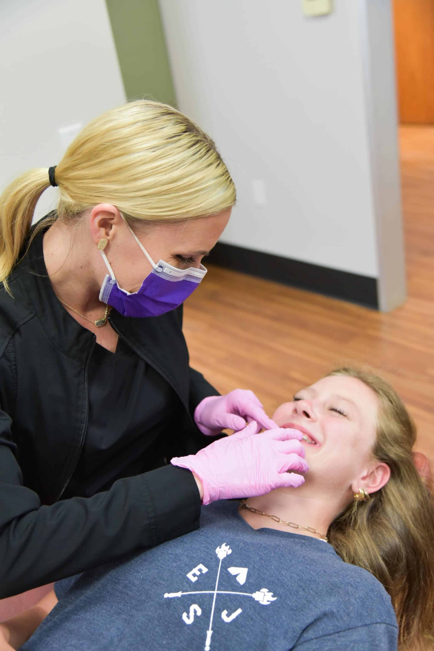 Dr. Jen helping patient